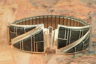 Genuine Picaso Marble from Utah inlaid between ribbons of Sterling Silver. Mens Watch Tips with Expandable Band. Created by Navajo Artists Nelson Chicharello and Ellla Cowboy.